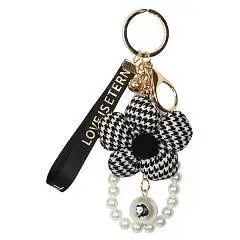 Брелок детский Модный цветок кожзам 11см КОКОС черно/белый, фото №1